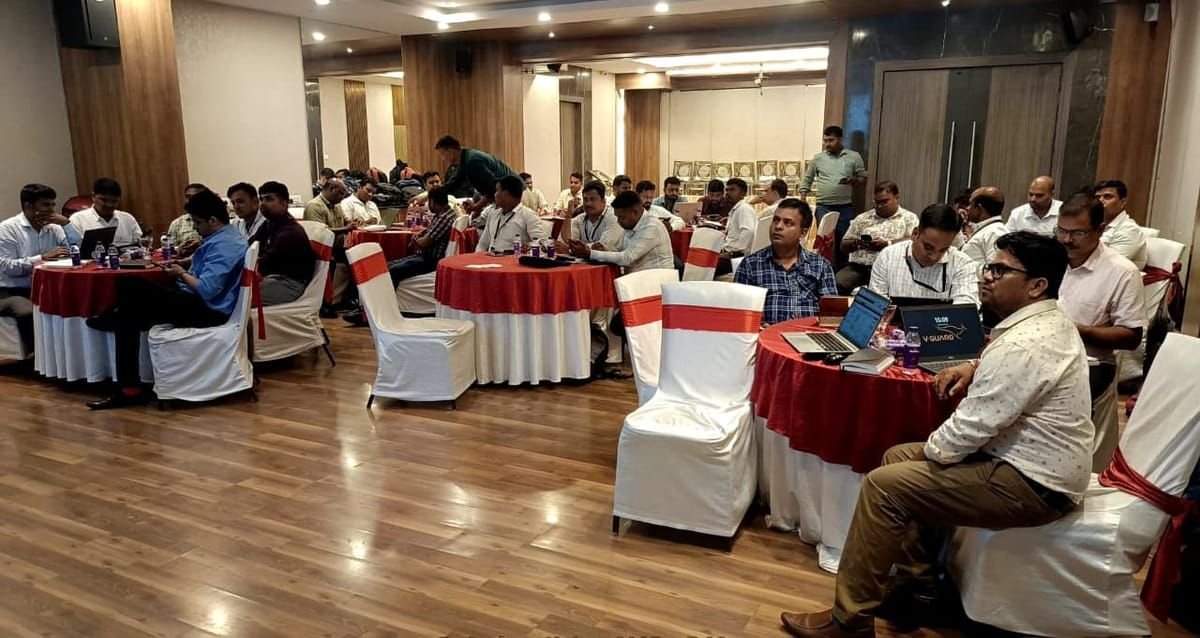 Training cohort of around twenty-five professionals at the close of a session